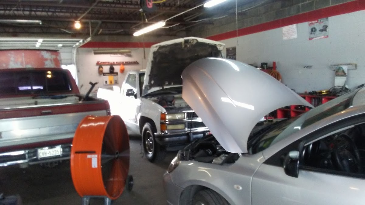 Engine on stand with disassembled components at Castillo Auto Repair